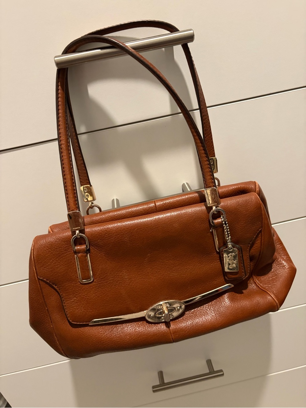 Coach Leather Shoulder Bag in Cognac Brown, gold accessories, red interior.